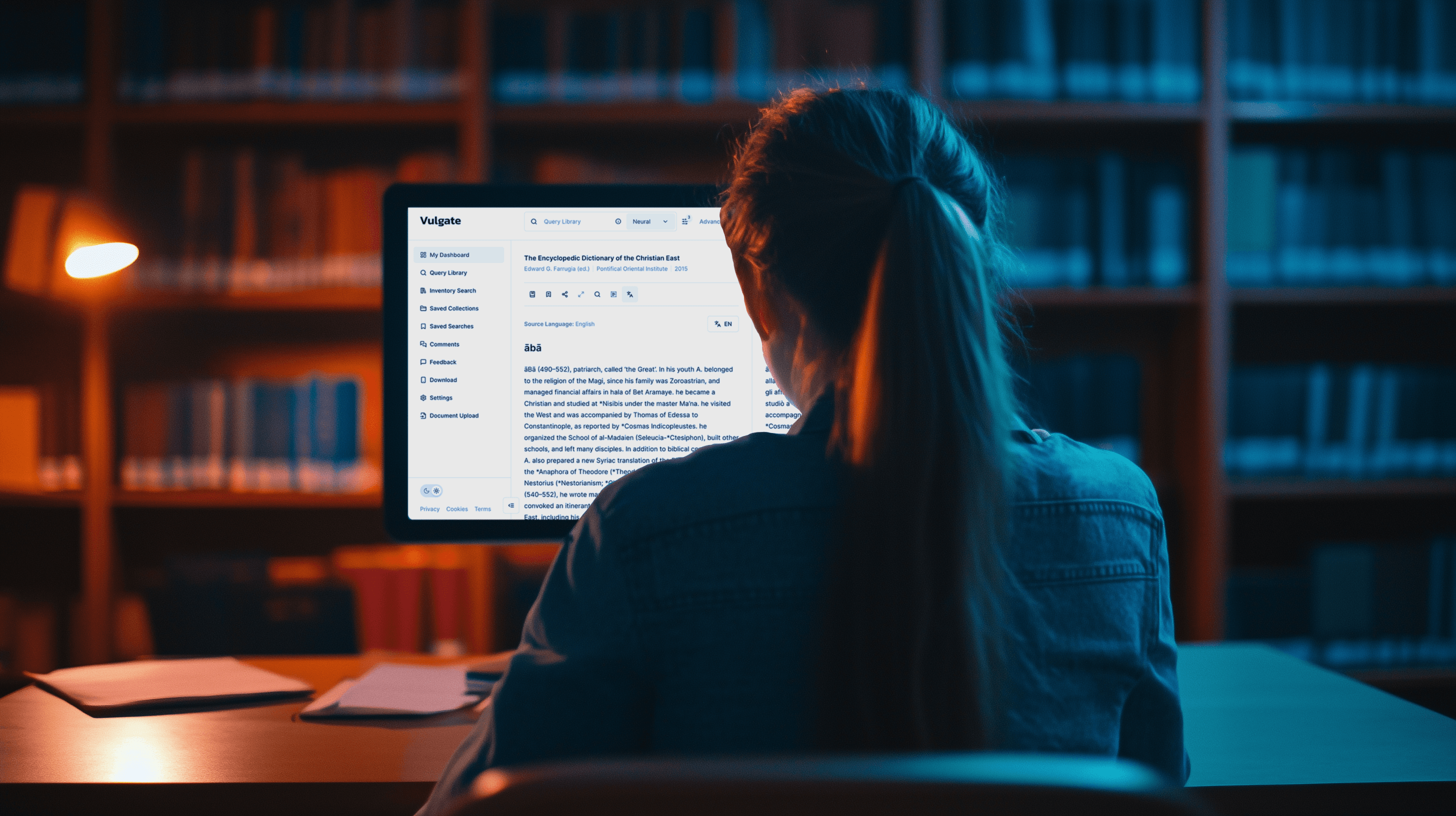A person working on a computer in a library.